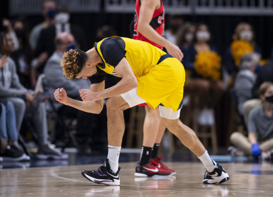 Indiana Pacers guard Chris Duarte (3) reacts after scoring a three-point basket during the first half of an NBA basketball game against the Toronto Raptors in Indianapolis, Friday, Nov. 26, 2021. (AP Photo/Doug McSchooler)