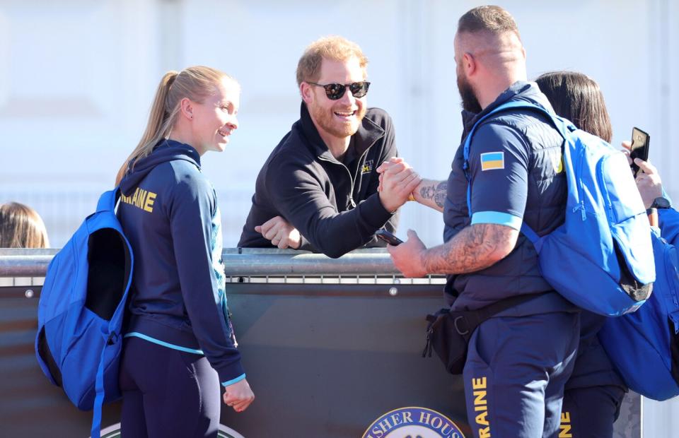 Prince Harry, Duke of Sussex talks to members of Invictus Team Ukraine at the Athletics Competition during day two of the Invictus Games The Hague 2020