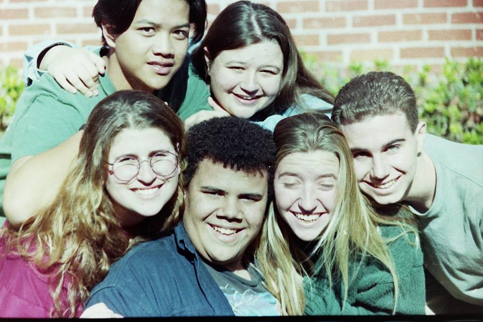 Steven Thrasher, lower center, surrounded by friends while a student at Oxnard High School.