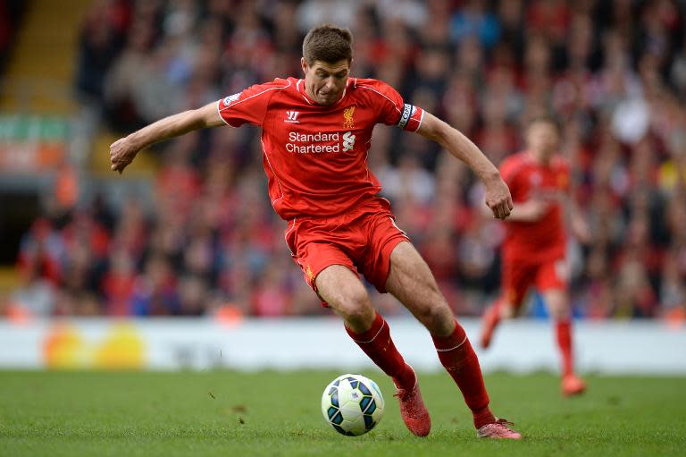 Liverpool's English midfielder Steven Gerrard runs with the ball during the English Premier League football match in Liverpool, England, on May 16, 2015