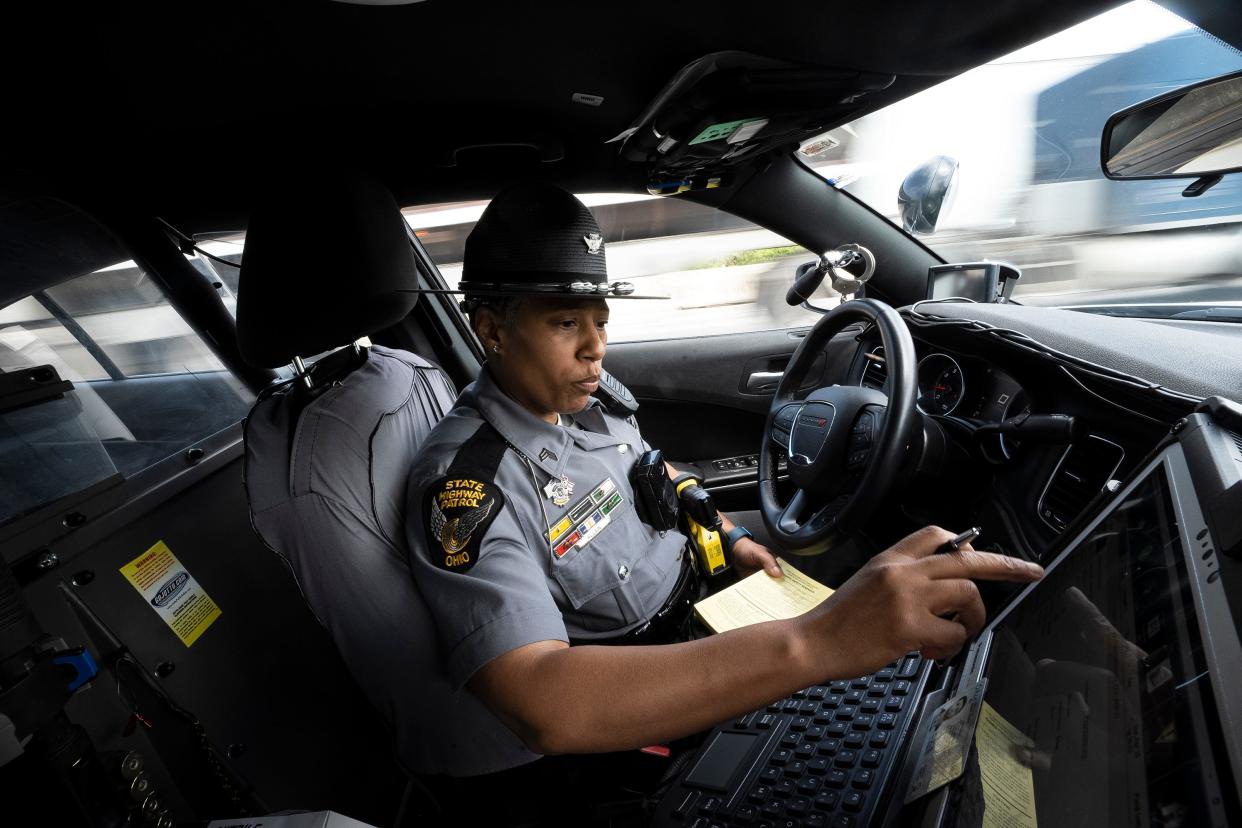 Ohio State Highway Patrol Sergeant Brandi Allen issues a warning to a driver in Franklin County. About 41% of drivers pulled over by the patrol in 2023 received warnings instead of tickets.