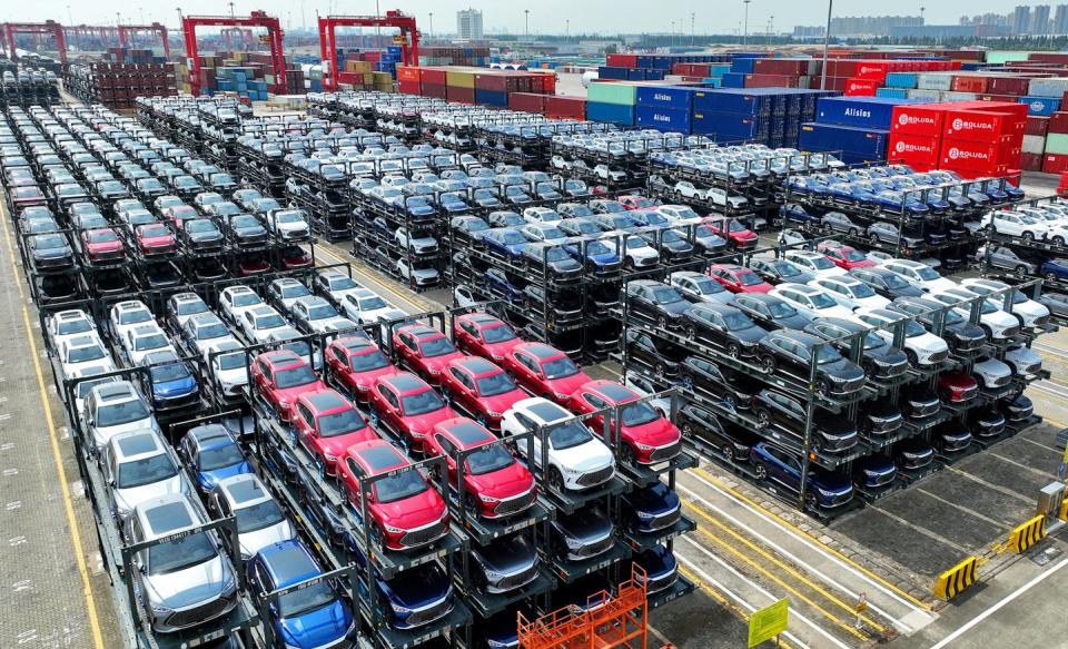 Hundreds of BYD vehicles wait at a port in Suzhou, China, to ship out. <a href="https://www.gettyimages.com/detail/news-photo/in-this-photo-taken-on-september-11-byd-electric-cars-news-photo/1659948305" rel="nofollow noopener" target="_blank" data-ylk="slk:AFP via Getty Images;elm:context_link;itc:0;sec:content-canvas" class="link ">AFP via Getty Images</a>