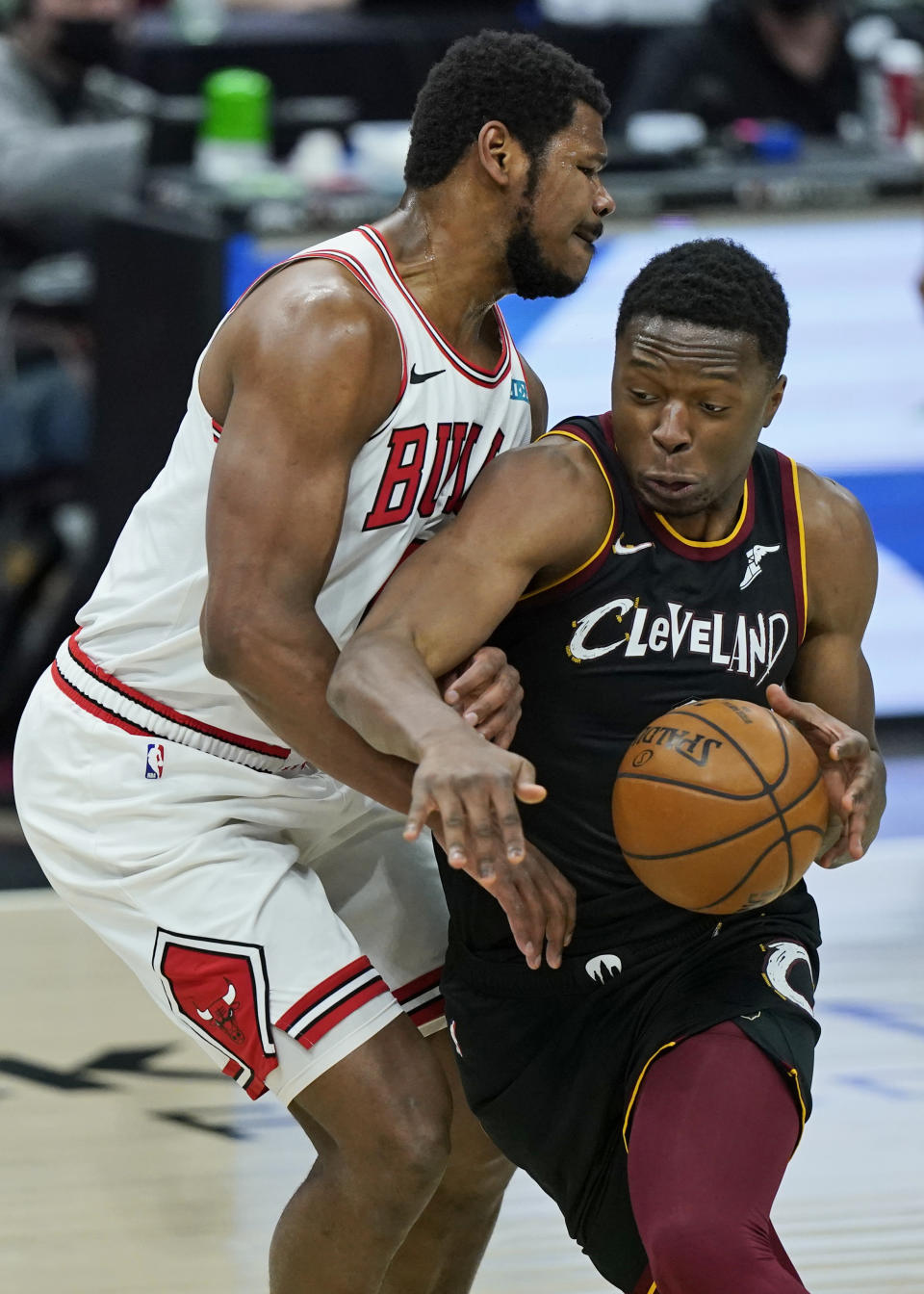 Cleveland Cavaliers' Mfiondu Kabengele, right, drives past Chicago Bulls' Cristiano Felicio during the second half of an NBA basketball game, Wednesday, April 21, 2021, in Cleveland. (AP Photo/Tony Dejak)