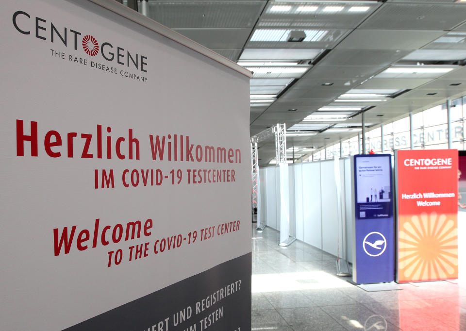 A picture taken on June 30, 2020 at the airport in Frankfurt am Main shows a sign at the entrance of a walk-in testing centre for the new coronavirus opened by German biotech company Centogene. - Frankfurt airport opened a walk-in testing centre on June 29, 2020 where passengers can pay to take a coronavirus test and get their results within hours, in a bid to reassure anxious travellers as the summer holidays kick off. Passengers will be notified of the result via a "secure digital platform" and the information can be connected to a boarding pass for those flying to countries requiring a negative test before entering, German biotech Centogene said in a statement. (Photo by Daniel ROLAND / AFP) (Photo by DANIEL ROLAND/AFP via Getty Images)