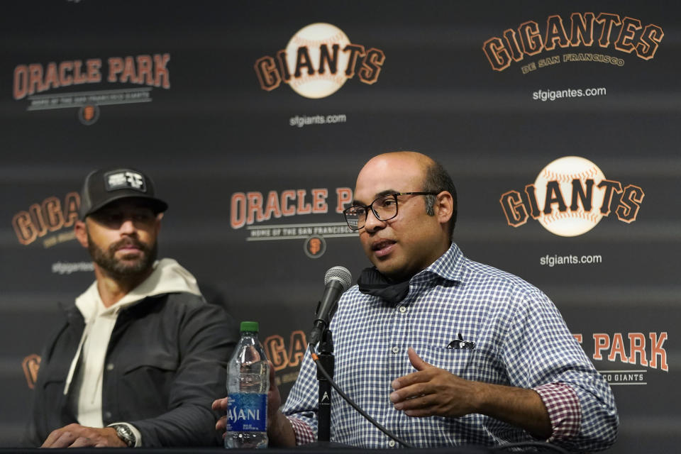 San Francisco Giants president of baseball operations Farhan Zaidi, left, speaks next to manager Gabe Kapler at a season-ending news conference in San Francisco, Monday, Oct. 18, 2021. (AP Photo/Jeff Chiu)