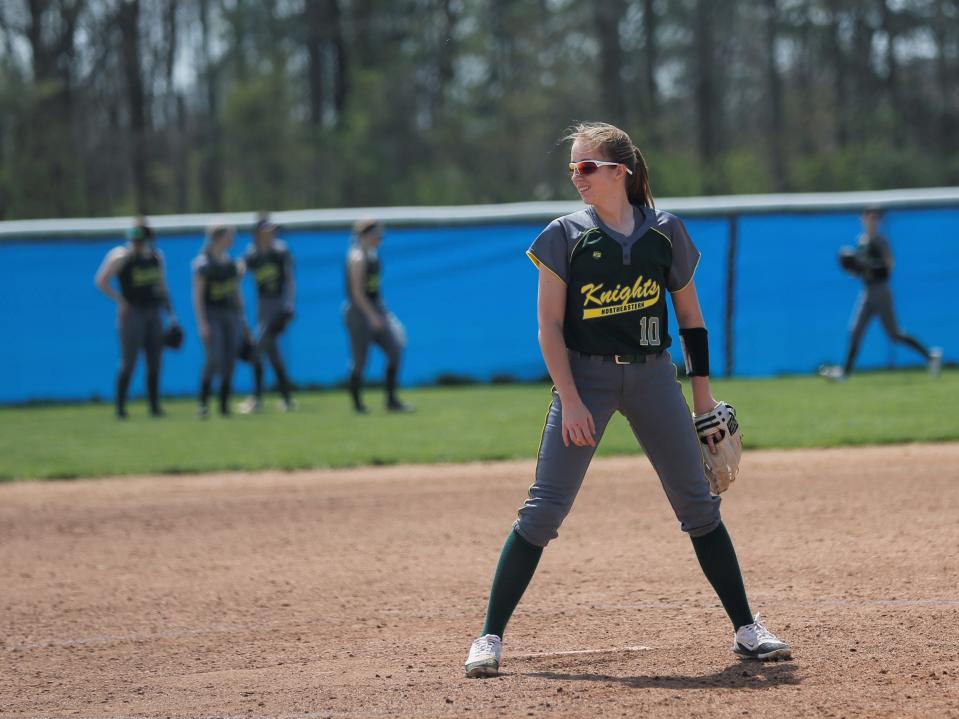 Northeastern sophomore Clare Lopeman smiles at a teammate before a Wayne County Tournament game April 23, 2022.