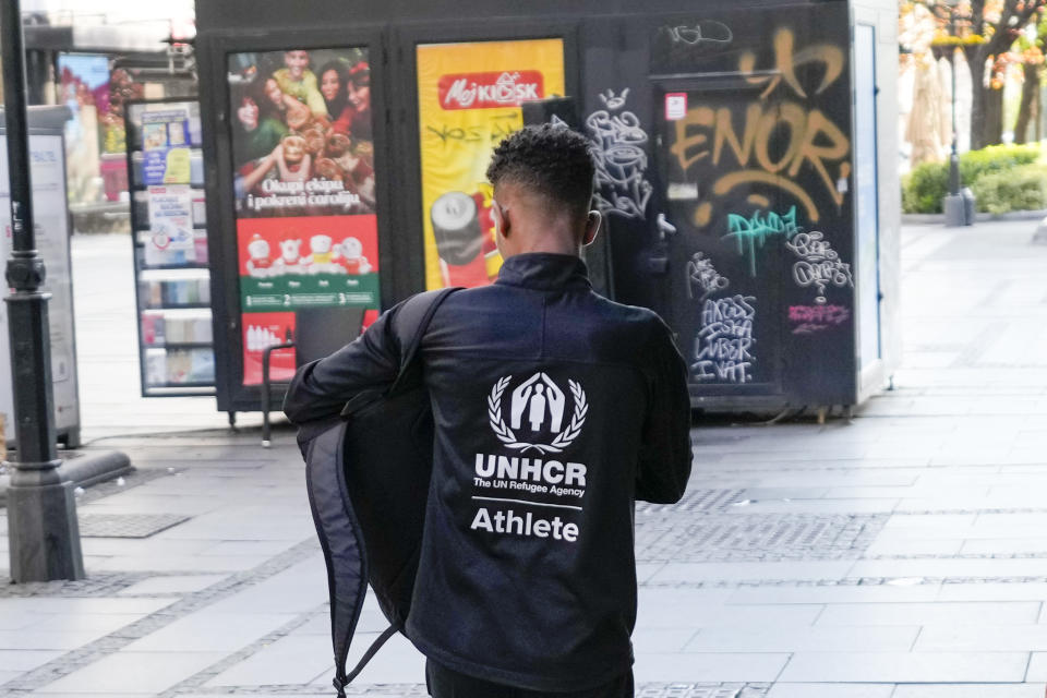 Tachlowini Gabriyesos, Eritrean born long distance runner walks on the street in Belgrade, Serbia, Sunday, April 23, 2023. Gabriyesos fled his native Eritrea and walked through the desert to reach Israel when he was just 12 years old. He is now running marathons, sending a message of hope and endurance to all refugees like himself. (AP Photo/Darko Vojinovic)