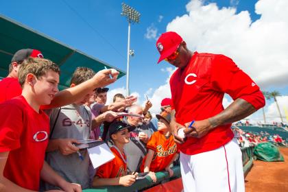 Aroldis Chapman signs autographs before a spring-training game earlier this month. (Getty)