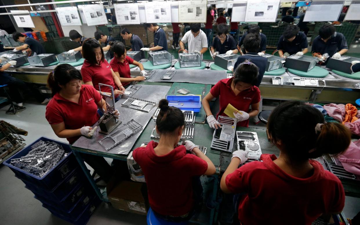 Employees at a Foxconn facility in China - Reuters