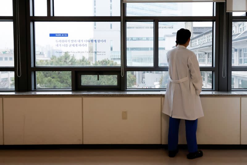 A medical worker uses a mobile phone at Severance Hospital