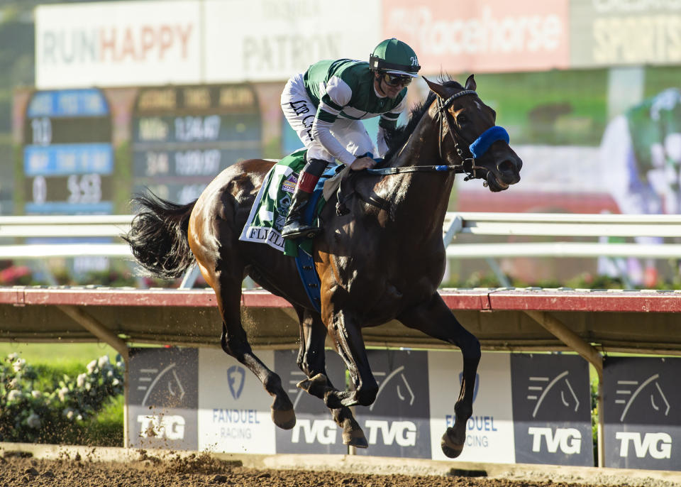 In this image provided by Benoit Photo, Flightline, with Flavien Prat aboard, wins the Grade I, $1,000,000 Pacific Classic horse race Saturday, Sept. 3, 2022, at Del Mar Thoroughbred Club in Del Mar, Calif. (Benoit Photo via AP)