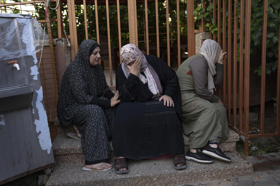 Palestinians at a morgue in Khan Younis on Tuesday mourn relatives killed in the Israeli bombardment of the Gaza Strip.