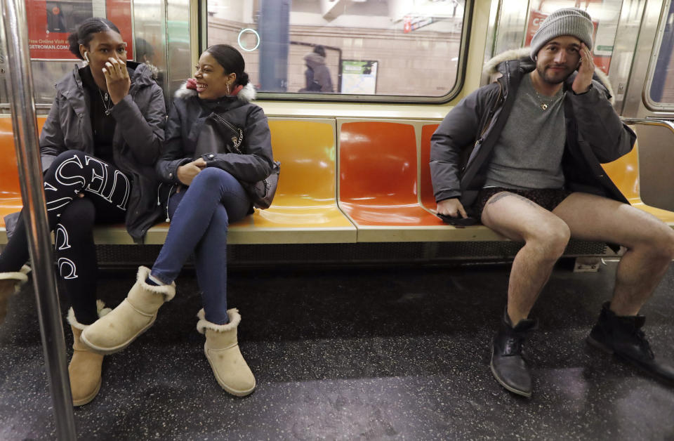 Passengers react to a man seated beside them without pants during the 18th annual No Pants Subway Ride, Jan. 13, 2019, in New York. (Photo: Kathy Willens/AP)