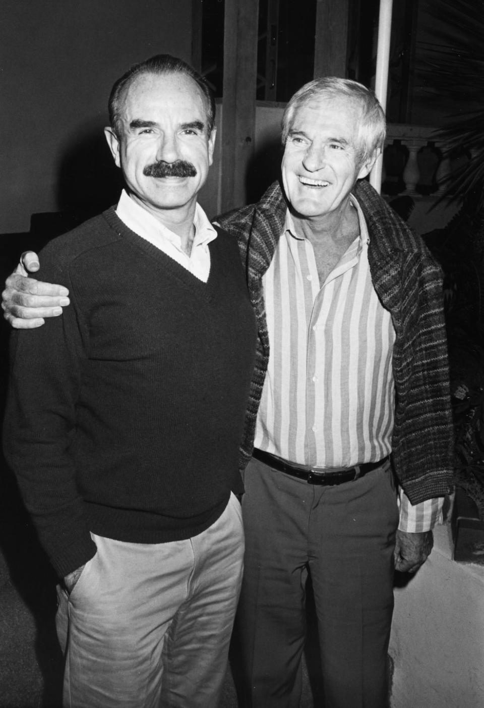 g gordon liddy and timothy leary smiling and embracing for a photo