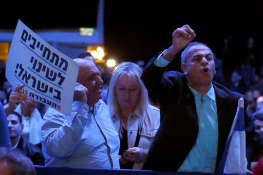 Members of Israel's Labour Party disrupt a speech by chairman Avi Gabbay during a party conference in Tel Aviv on January 10, 2019