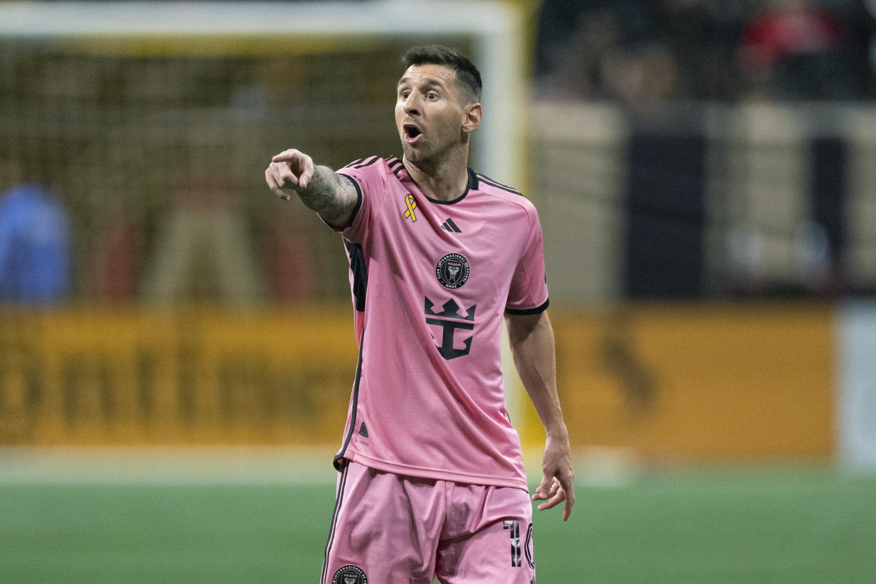 Inter Miami forward Lionel Messi talks to a teammate during the second half of a MLS soccer match against Atlanta United Wednesday, Sept. 18, 2024. (AP Photo/John Bazemore)