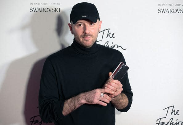 <div class="inline-image__caption"><p>Designer Demna Gvasalia of fashion house Balenciaga poses with his award after being named winner of the International Ready-to-Wear Designer award during the British Fashion Awards 2016 in London on December 5, 2016.</p></div> <div class="inline-image__credit">DANIEL LEAL/AFP via Getty Images</div>