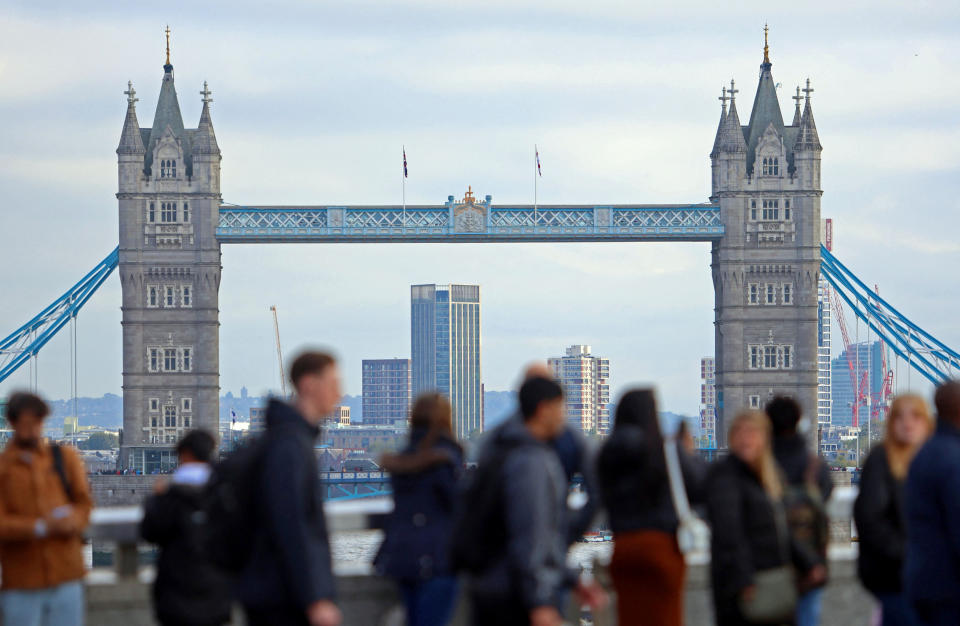 UK economy  People walk over London Bridge looking at a view of Tower Bridge in the City of London financial district in London, Britain, October 25, 2023.  REUTERS/ Susannah Ireland