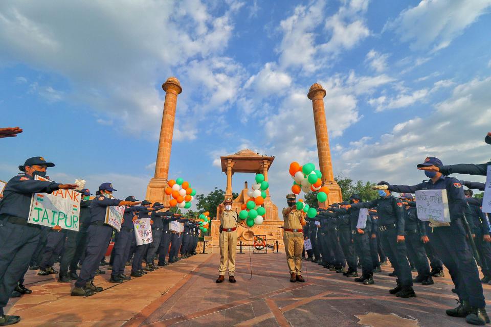 Nirbhaya Squad members of the police take oath for public safety and spread awareness on the their foundation day, at Amar Jawan Jyoti in Jaipur on 24 September.