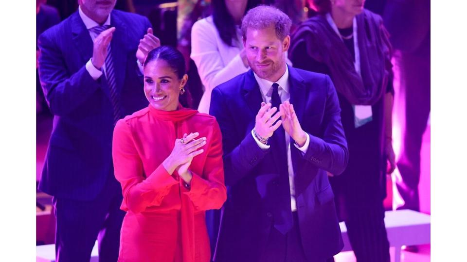 The Duchess and Duke of Sussex applauding