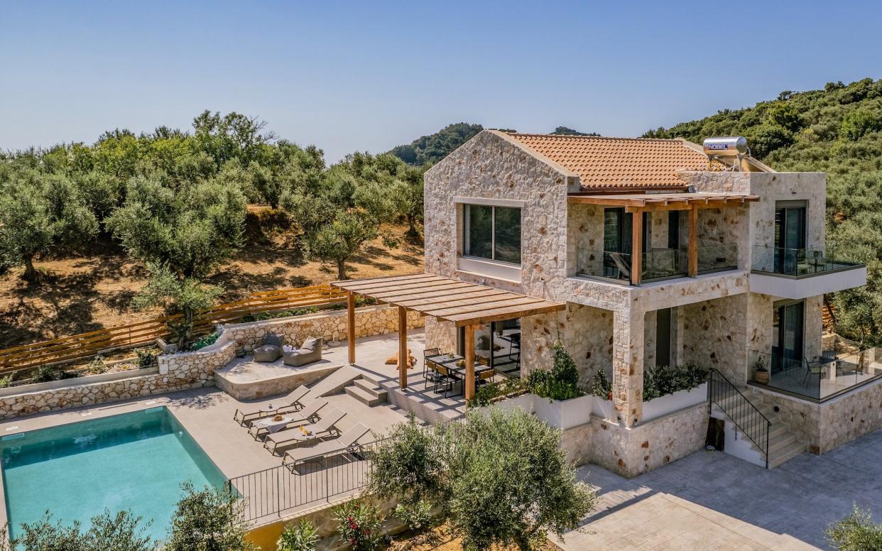 Large stone walled villa with a swimming pool