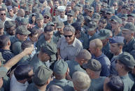 <p>American servicemen in Vietnam greet evangelist Billy Graham during his Christmas visit with troops, Dec. 21, 1966. (Photo: AP) </p>