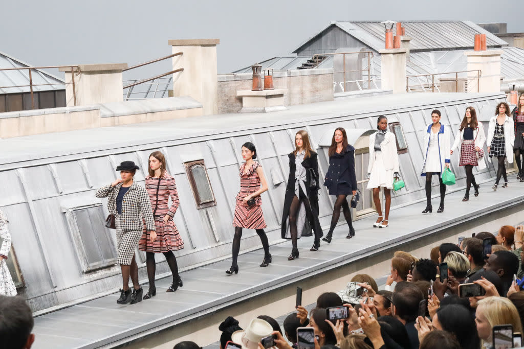 YouTuber Marie S’Infiltre crashing the Chanel catwalk. [Photo: Getty/AP]