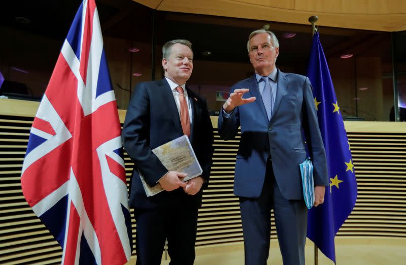 FILE PHOTO: The European Union's chief Brexit negotiator Michel Barnier and British negotiator David Frost at the start of post -Brexit trade deal talks