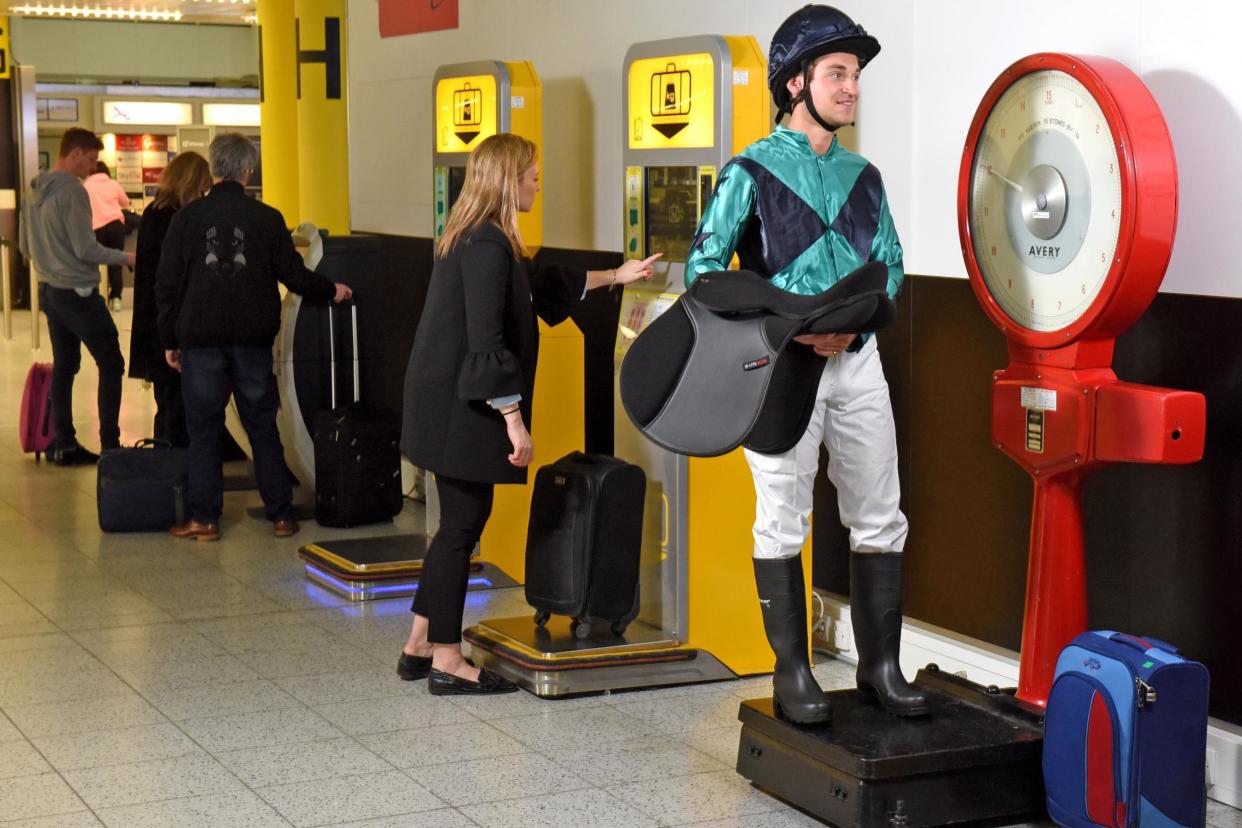 Jockey scales: Passengers can weigh their bags on the authentic scales: Gatwick Airport