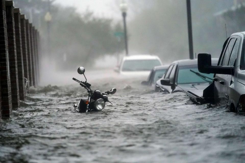 PHOTO: In this Sept. 16, 2020, file photo, flood waters move on the street, in Pensacola, Fla. (Gerald Herbert/AP)