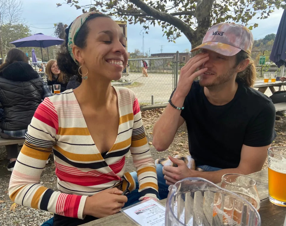 Chase VanLeeuwen, 30, laughs with his fiancé, Jasmine Greenwood, at an Asheville restaurant. VanLeeuwen was an audio engineer from Pennsylvania, who was shot and killed in an armed robbery at a West Asheville recording studio Dec. 22.