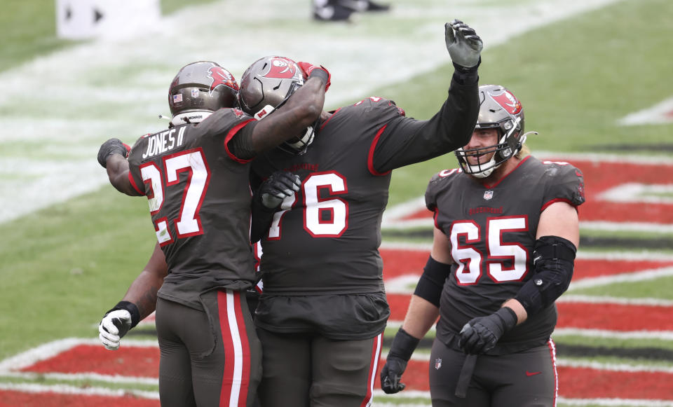 Tampa Bay Buccaneers running back Ronald Jones (27) celebrates his score against the Atlanta Falcons during the second half of an NFL football game Sunday, Jan. 3, 2021, in Tampa, Fla. (AP Photo/Mark LoMoglio)