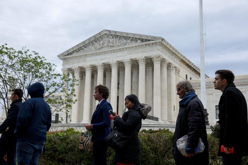 People wait in line outside the U.S. Supreme Court Building to hear oral arguments on October 03, 2022 in Washington, DC.