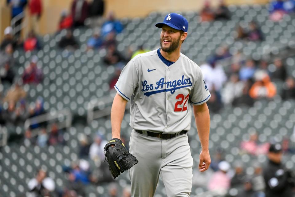 Los Angeles Dodgers pitcher Clayton Kershaw heads back to the dugout after the final out of the seventh inning of a baseball game against the Minnesota Twins, Wednesday, April 13, 2022, in Minneapolis. Kershaw threw seven perfect innings before being relieved as the Dodgers won 7-0. (AP Photo/Craig Lassig)