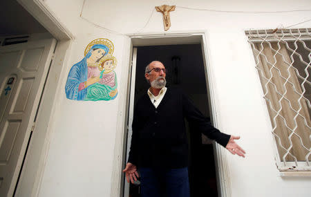 Christian artist and sculptor Naser Jeldha gestures outside his studio in Gaza City December 4, 2016. REUTERS/Suhaib Salem