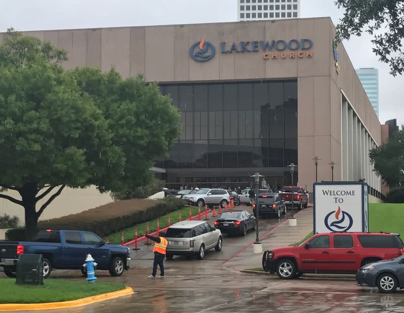 FILE PHOTO: Vehicles queue to deliver supplies for Hurricane Harvey evacuees at the nondenominational Lakewood Church in Houston