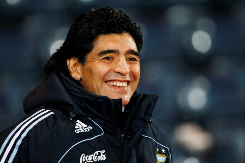 FILE PHOTO: Argentina's soccer team head coach Maradona smiles during their international friendly soccer match against Scotland in Glasgow, Scotland