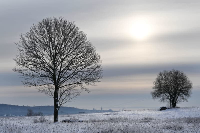 Snow lies on the fields not far from the town of Nordhausen. The German Weather Service warns of extremely icy conditions and heavy snowfall in parts of Germany. Martin Schutt/dpa