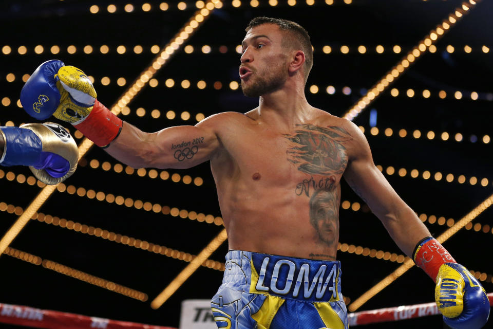 Vasyl Lomachenko, of Ukraine, reacts toward Guillermo Rigondeaux at the end of the second round of a WBO junior lightweight title boxing match Saturday, Dec. 9, 2017, in New York. Lomachenko won the bout. (AP Photo/Adam Hunger)