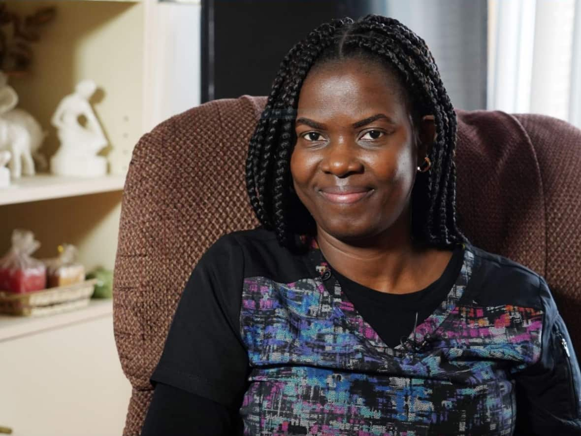 Kate Onakpo, who crossed at Roxham Road in 2017, now works as a caregiver in Montreal.  (Charles Contant/CBC - image credit)