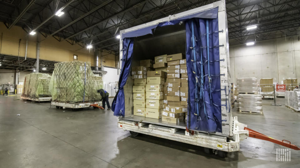 Small boxes are stacked together in an air cargo container. (Photo: Jim Allen/FreightWaves)