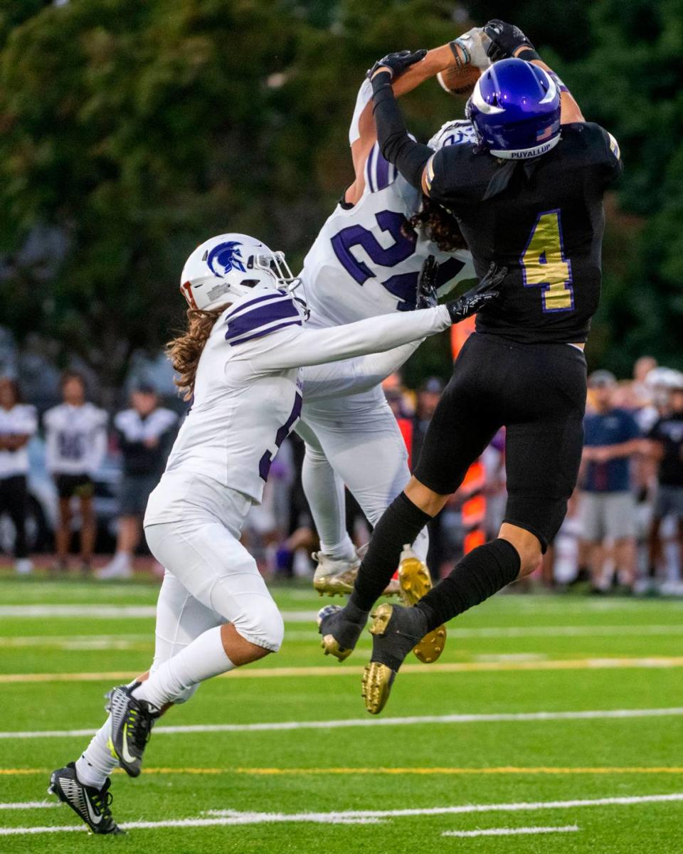 Sumner defensive back Jay Mentink intercepts a pass intended for Puyallup’s Dane Parker during the first quarter of a 4A SPSL game on Friday, Sept. 23, 2022, at Sparks Stadium in Puyallup, Wash.