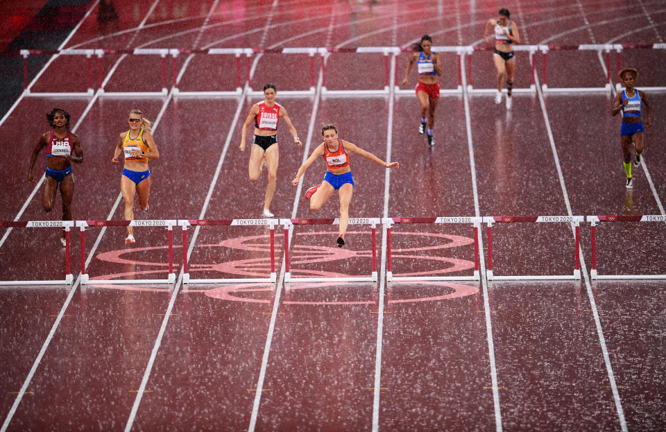 <p>TOKYO, JAPAN - AUGUST 02: Femke Bol of Team Netherlands clears the final hurdle as rain falls in the Women's 400 metres hurdles semi finals on day ten of the Tokyo 2020 Olympic Games at Olympic Stadium on August 02, 2021 in Tokyo, Japan. (Photo by Matthias Hangst/Getty Images)</p> 