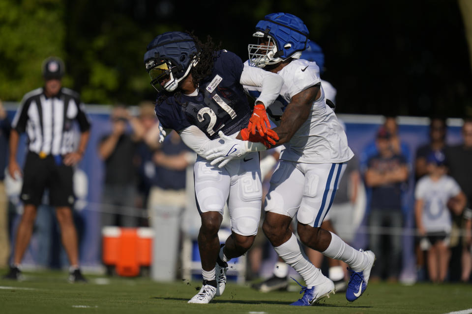 Chicago Bears running back D'Onta Foreman (21) works against Indianapolis Colts linebacker Shaquille Leonard (53) during an NFL football joint practice at the Colts' training camp in Westfield, Ind., Wednesday, Aug. 16, 2023. (AP Photo/Michael Conroy)