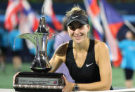 Tennis - WTA Premier 5 - Dubai Tennis Championships - Dubai Duty Free Tennis Stadium, Dubai, United Arab Emirates - February 23, 2019 Switzerland's Belinda Bencic celebrates with a trophy after winning the final against Czech Republic's Petra Kvitova REUTERS/Ahmed Jadallah