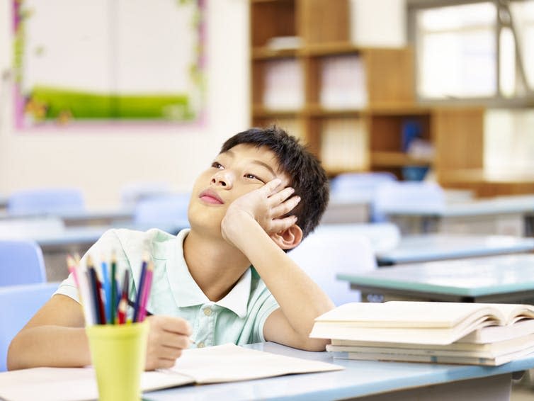 <span class="caption">There are benefits to daydreaming.</span> <span class="attribution"><a class="link " href="https://www.shutterstock.com/image-photo/asian-elementary-schoolboy-thinking-while-doing-596186087?src=dqsQUKt9rGfiC65PvQoDbg-1-70" rel="nofollow noopener" target="_blank" data-ylk="slk:imtmphoto/Shutterstock;elm:context_link;itc:0;sec:content-canvas">imtmphoto/Shutterstock</a></span>