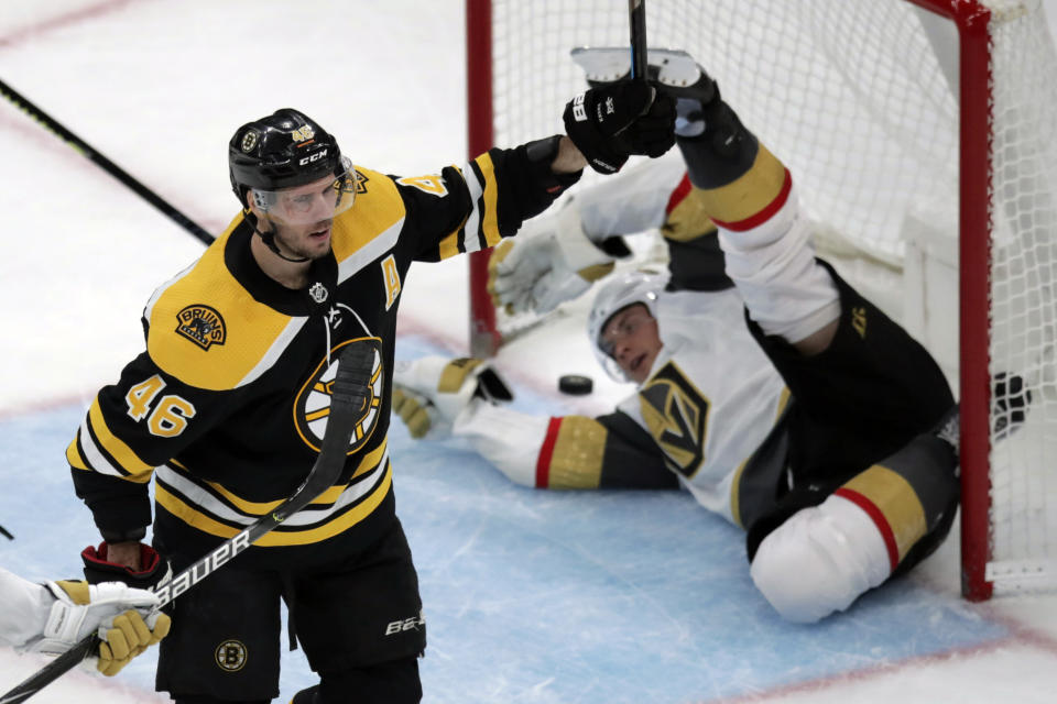 Boston Bruins center David Krejci (46) celebrates after scoring on Vegas Golden Knights defenseman Nick Holden, rear, during the third period of an NHL hockey game in Boston, Tuesday, Jan. 21, 2020. (AP Photo/Charles Krupa)