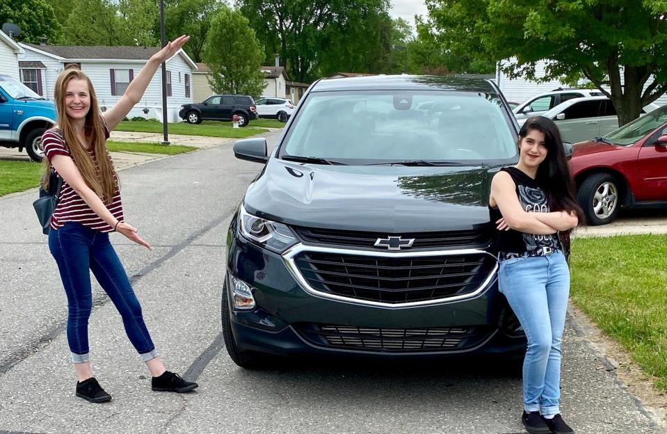 Kayla Ode (left) of the Brian Carroll Automotive Group delivered a 2020 Chevrolet Equinox on May 27, 2020 to Sheena Leaman, a machine operator from Clinton Township.