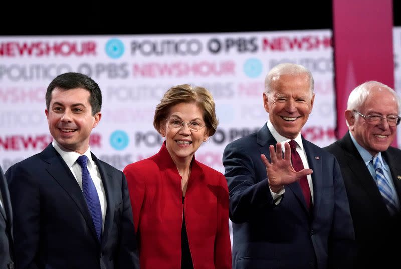 Candidates stand together at the start of the sixth 2020 U.S. Democratic presidential candidates campaign debate at Loyola Marymount University in Los Angeles, California, U.S.