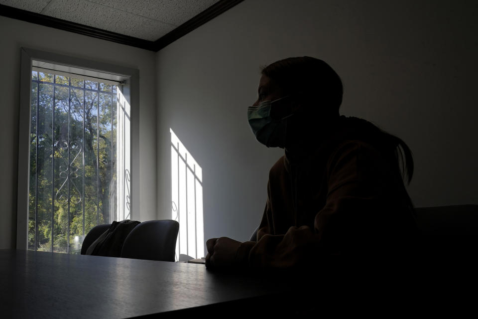 Haley Ruark talks to a reporter while waiting to get a medical abortion at a Planned Parenthood clinic Wednesday, Oct. 12, 2022, in Kansas City, Kan. (AP Photo/Charlie Riedel)